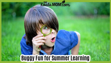 Buggy Fun for Summer Learning. Photo of a child with a magnifying glass laying in the grass via Depositphotos.