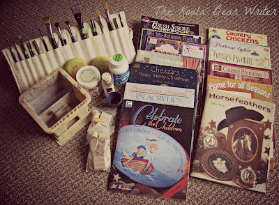 My folk art painting supplies, including brushes and books