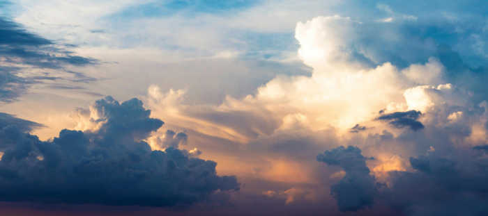 Photo of pink highlights on blue and white clouds by Pixabay.