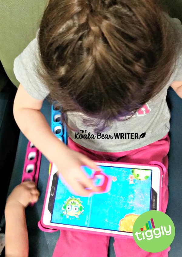 Lily playing a Tiggly Counts game on my tablet