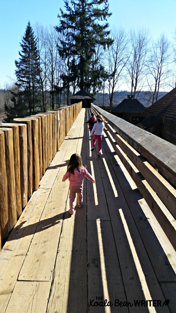 Girls running along the walls at Fort Langley National Historic Site, BC