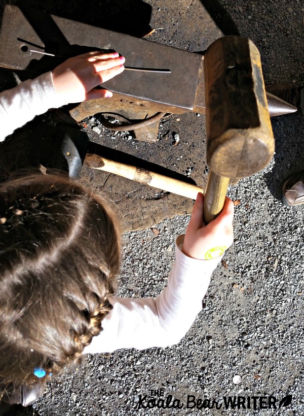 Sunshine tries to be a blacksmith at Fort Langley National Historic Site, BC