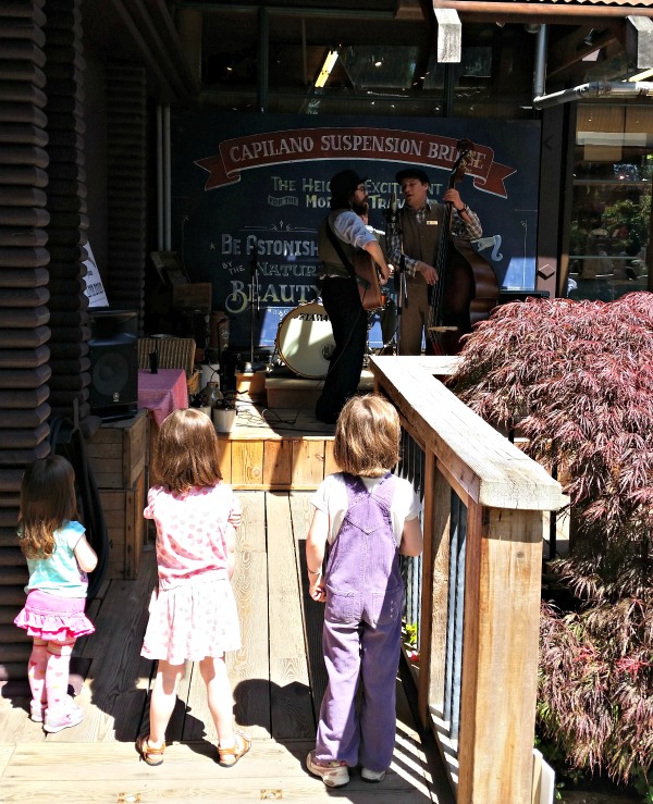 Girls watching the live music at Capilano Suspension Bridge Park