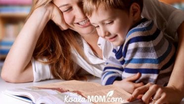 Mom reading her favourite kids' Bible to her son.
