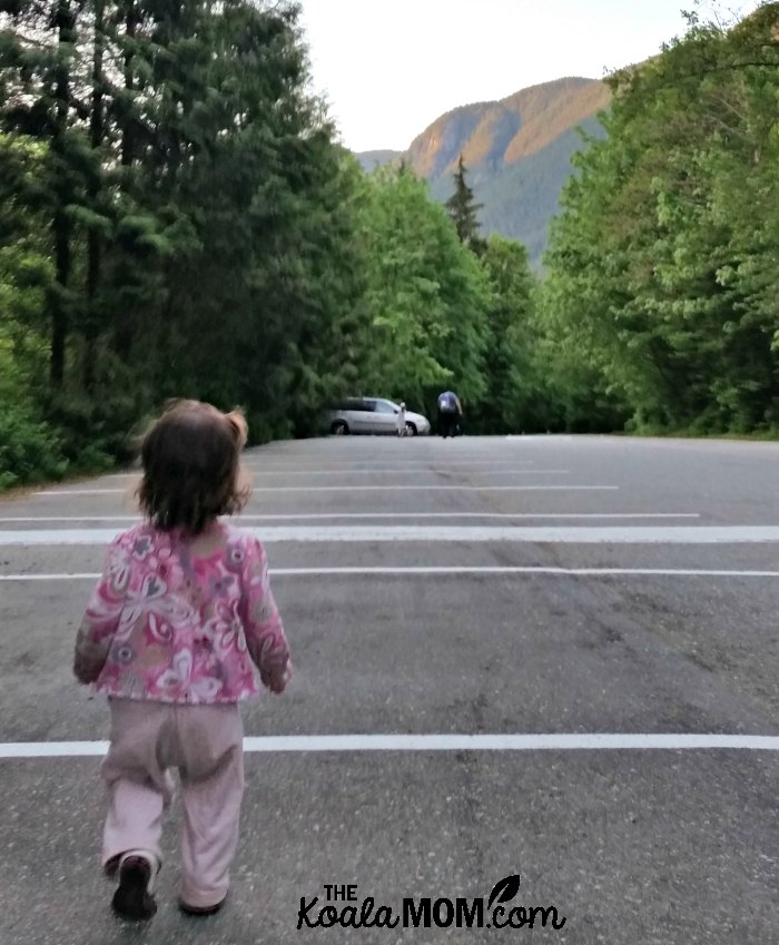 Toddler walking down the Buntzen Lake Parking Lot