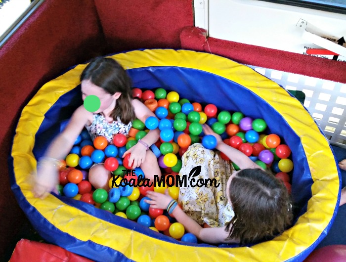 Sunshine and Lily in the ball pit at a Fun GymBus birthday party