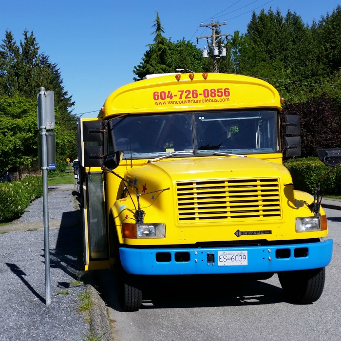 Vancouver Fun GymBus parked on the street while kids play inside