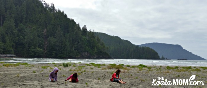Girls playing in the sand at San Josef Bay in Cape Scott Provincial Park
