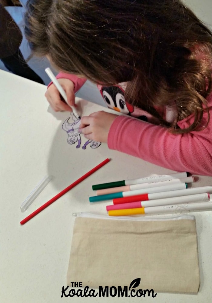 Sunshine colouring a superhero girl from her My FUNvelope kids crafts envelope.