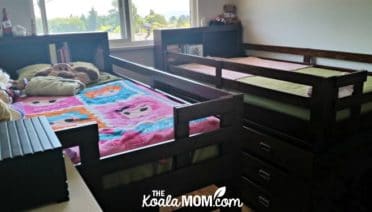Two loft beds in a room.
