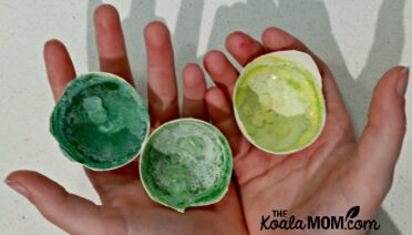 Child holding her eggshell geode science experiment.