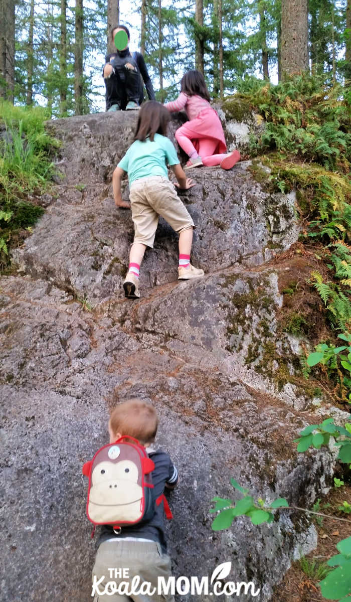 Kids climbing a rock in Minnekhada Park