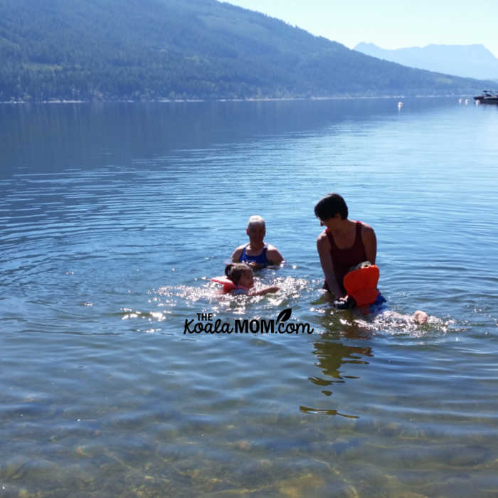 Mom and Grandma swimming with kids in Shuswap Lake.