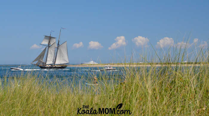 View of a tall ship at full sail from Nantucket Island.