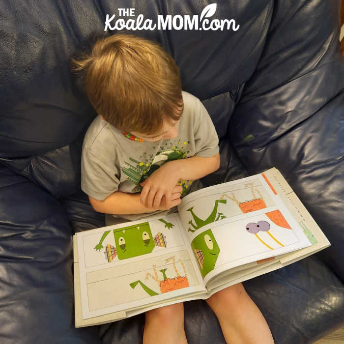 4-year-old boy reading The Line in the Sand by Thao Lam.