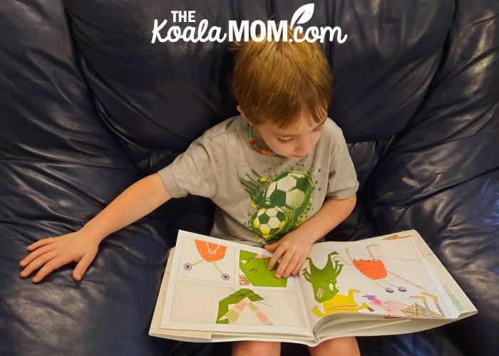 4-year-old boy reading The Line in the Sand by Thao Lam.