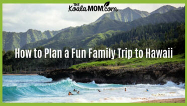 How To Plan A Fun Family Trip To Hawaii. Photo of people swimming on a beach in Hawaii with mountains above by Luke McKeown on Unsplash