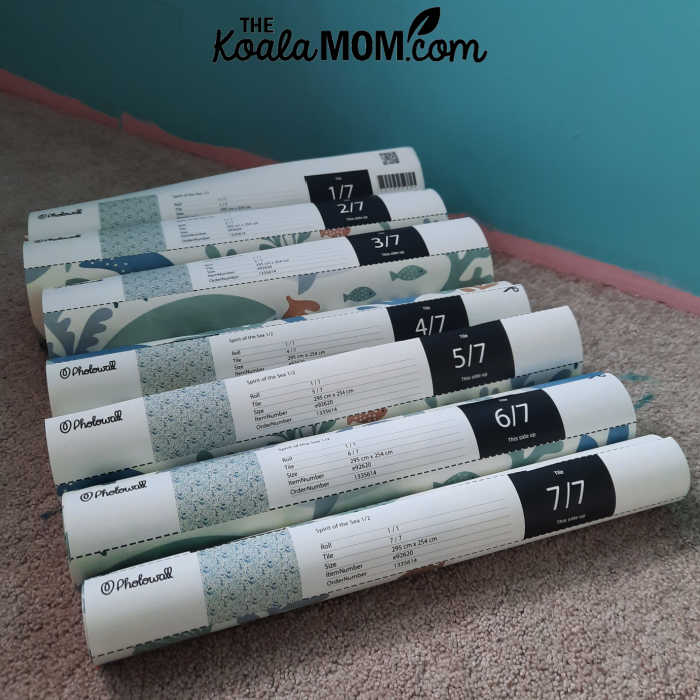 Seven rolls of Photowall wallpaper, ready to be pasted to the wall.