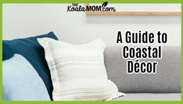 A Guide to Coastal Décor. Photo of living room in greys / blues with beach photo above couch by Rachel Claire via Pexels.
