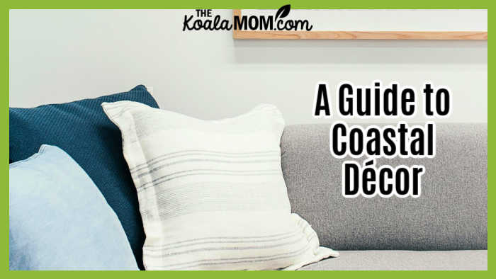 A Guide to Coastal Décor. Photo of living room in greys / blues with beach photo above couch by Rachel Claire via Pexels.
