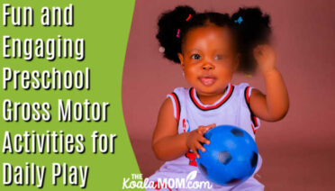 Fun and Engaging Preschool Gross Motor Activities for Daily Play. Photo of little girl holding a blue soccer ball by Mika Photogenius via Pexels.