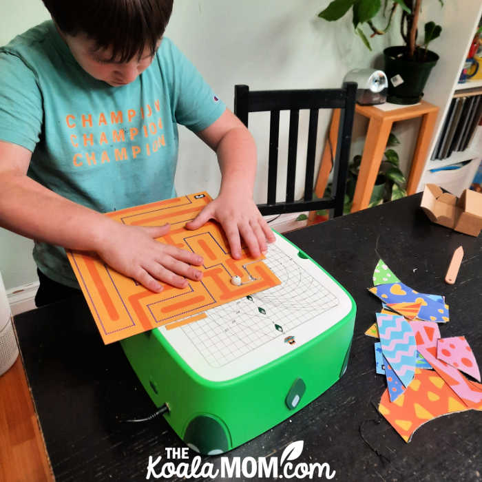 Photo of boy tracing a maze on a piece of cardboard with his BeaverBot Cutter C2 by Bonnie Way.