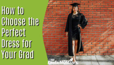 How to Choose the Perfect Dress for Graduation Day. Photo of a woman wearing a classy black dress under her graduation gown, standing against a brick wall, by Laura Garcia via Pexels.