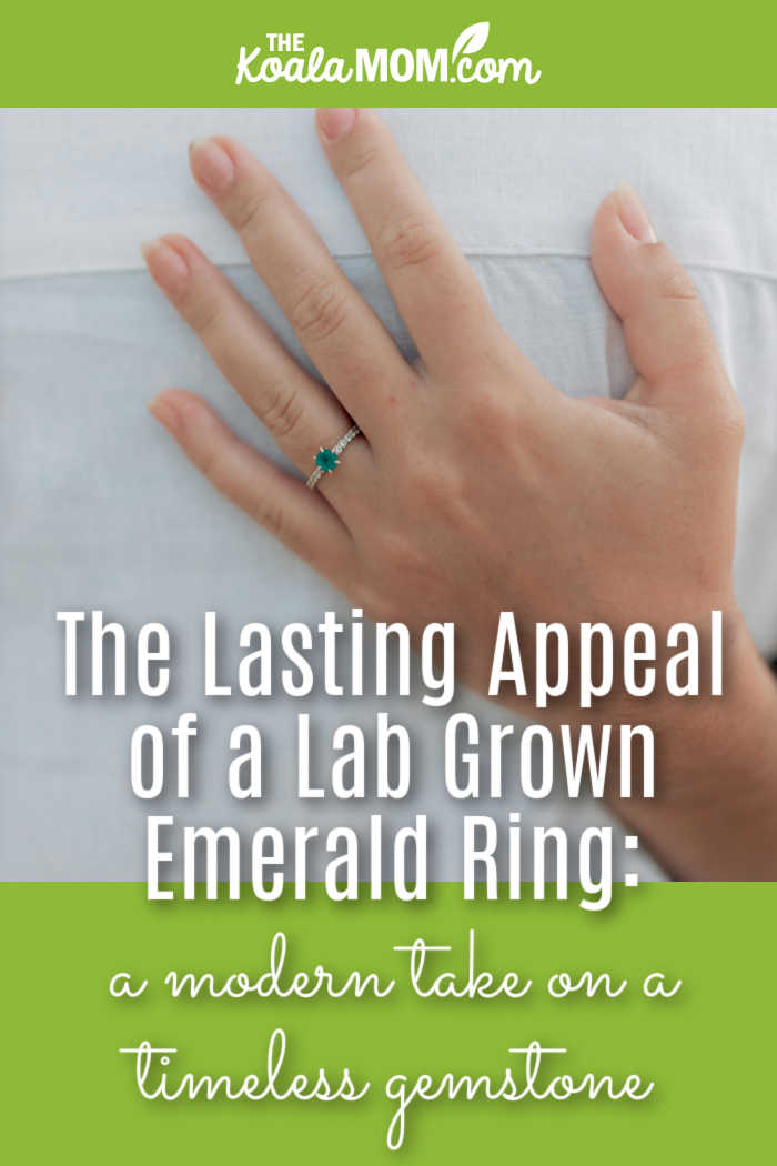 The Lasting Appeal of a Lab Grown Emerald Ring: a modern take on a timeless gemstone. Photo of small emerald ring on a woman's ring hand against a white background by Alexander Mass via Pexels.