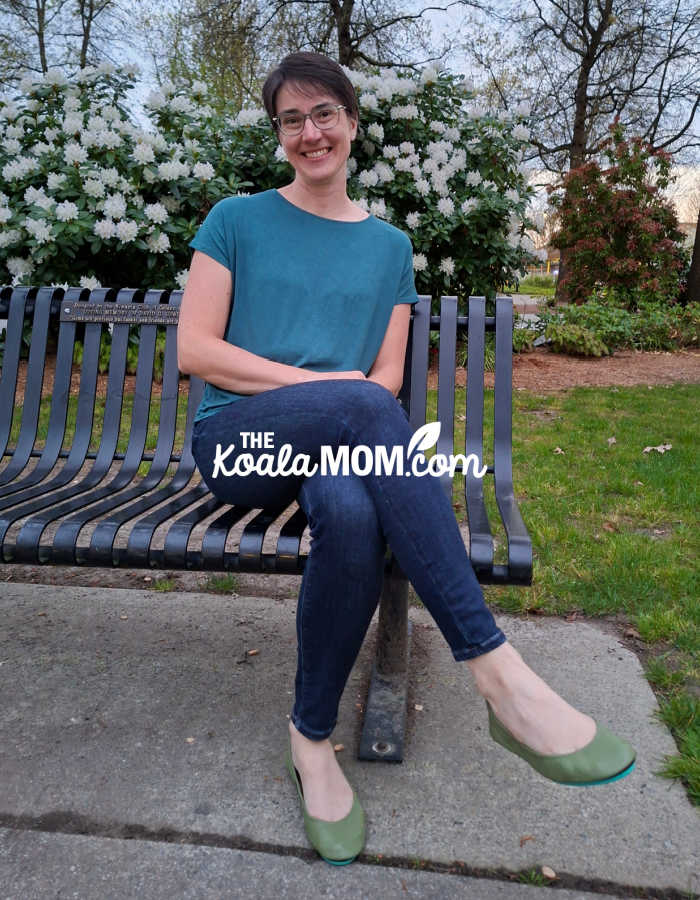 Bonnie Way sits on a park bench with her olive green Tieks ballet flats. Photo by her daughter.