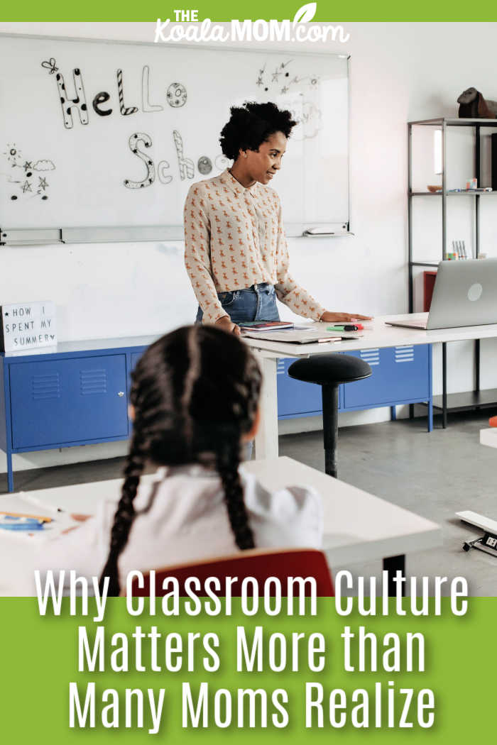 Why Classroom Culture Matters More than Many Moms Realize. Photo of black teacher in front of whiteboard reading "hello school" by Pavel Danilyuk via Pexels.