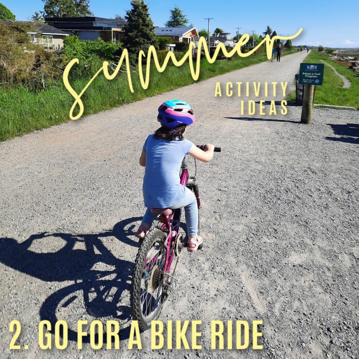 Summer activity ideas 2. Go for a bike ride. Photo of girl on a bike on a gravel trail by Bonnie Way.