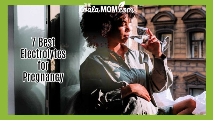 7 Best Electrolytes for Pregnancy. Photo of black woman with curly hair drinking water from a wine glass while resting her hand on her pregnant stomach by cottonbro studio via Pexels.